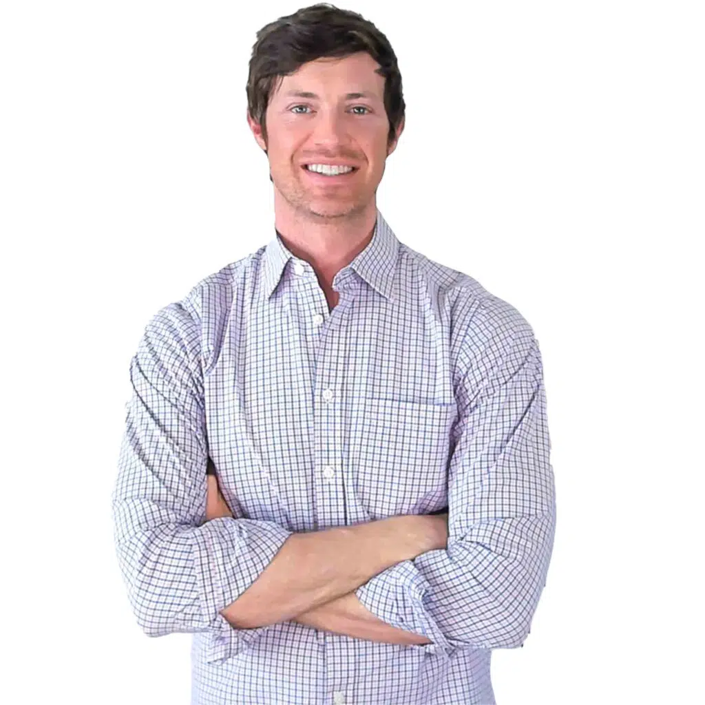 picture of dr. westin childs with his arms folded in a button up shirt. 