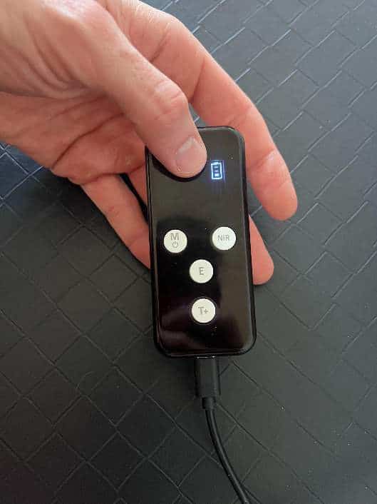 Charging cable connected to the bottom USB-C port of the shared controller.